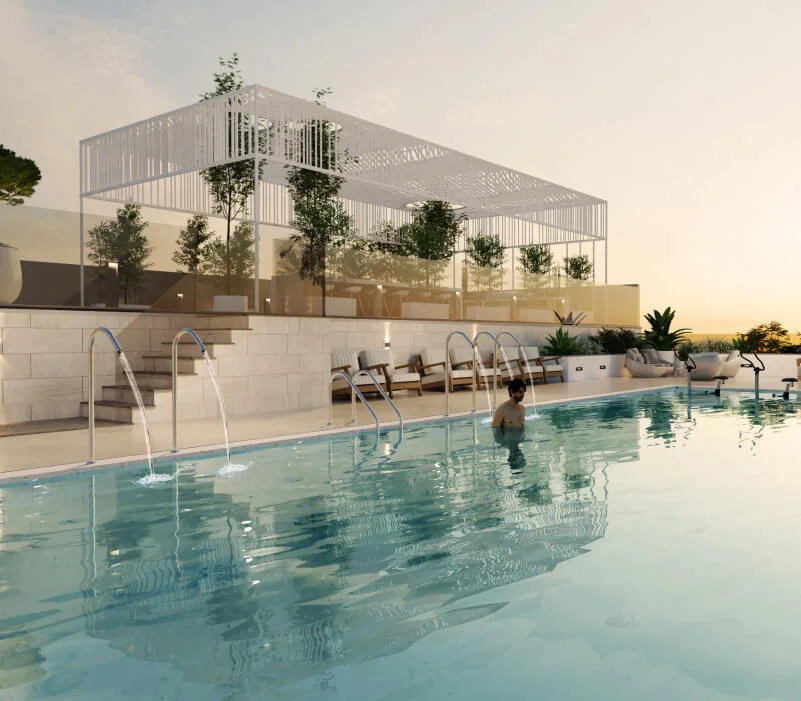 Luxury rooftop swimming pool with cascading water features and modern lounge seating at Marquis Insignia, Dubai.